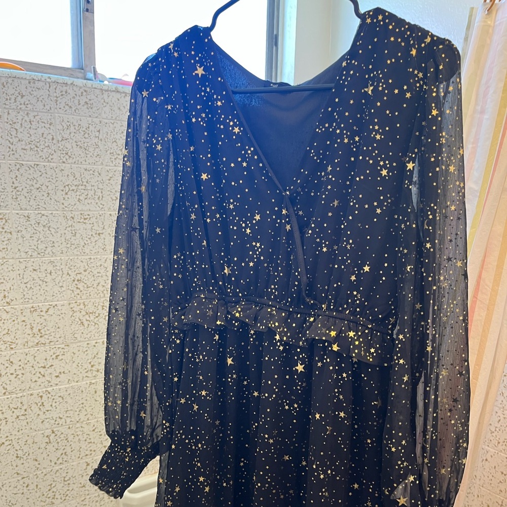 August Sky black homecoming dress with gold stars.